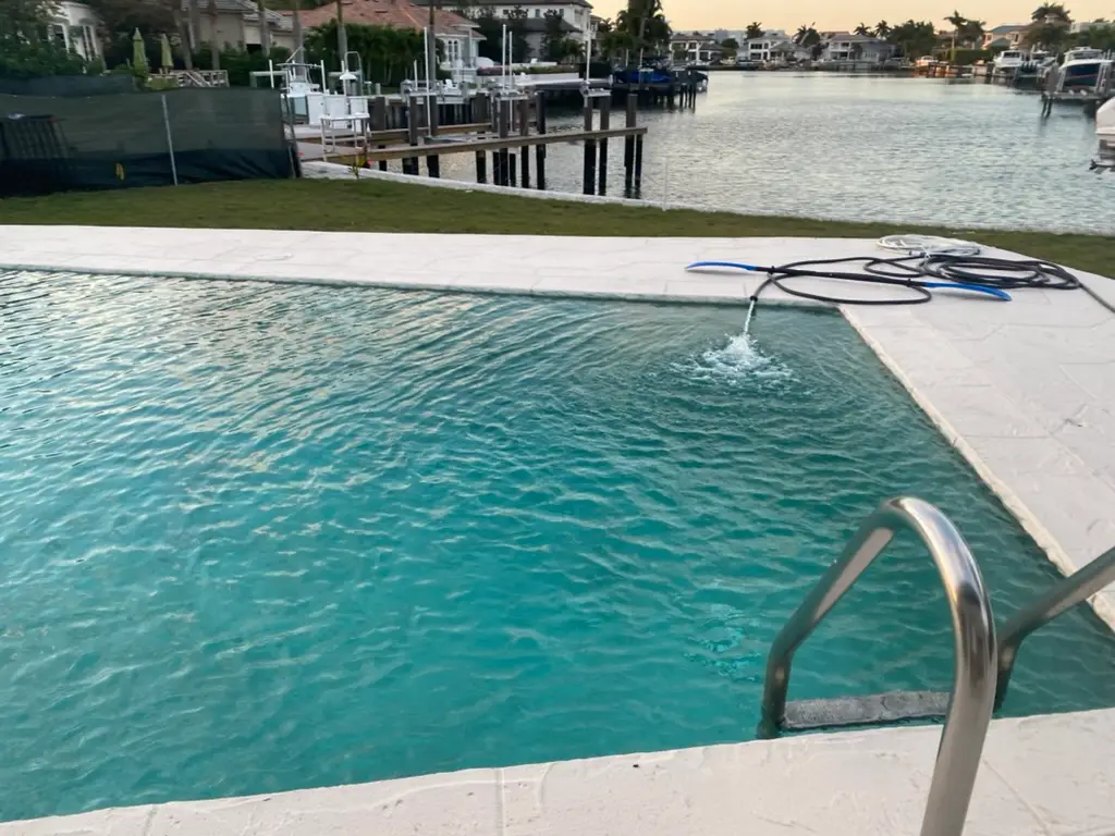 Pool leak detection equipment testing a waterfront pool in Naples, FL