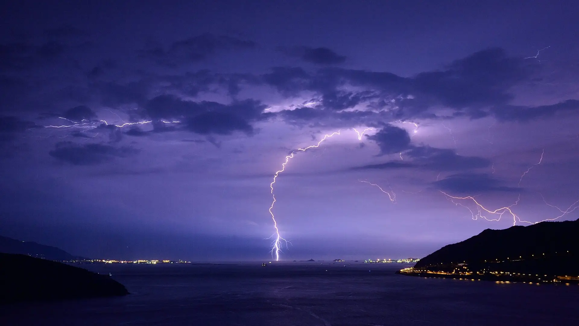 Lightning storm over Naples, FL representing storm and electrical damage pool equipment repair