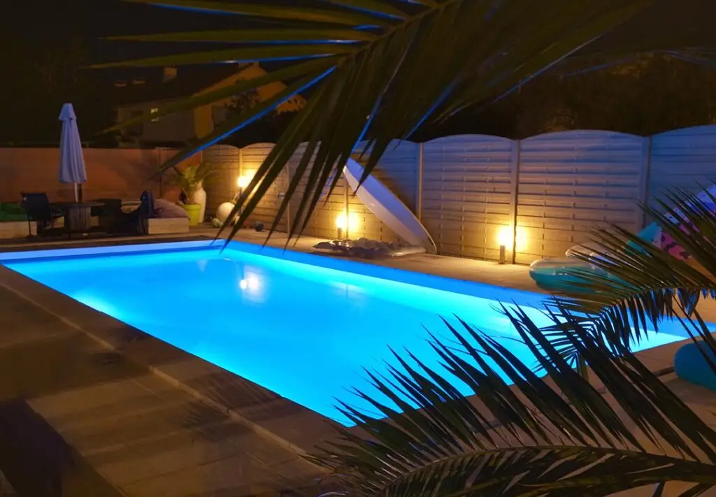 Backyard pool with equipment area serviced by Pool Repair Naples FL